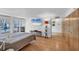 Bright bedroom with hardwood floors and access to a pool through glass doors at 448 58Th St, Sarasota, FL 34243