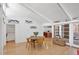 Dining room and light-filled living spaces with contemporary decor, featuring hardwood floors at 448 58Th St, Sarasota, FL 34243