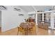 Dining area featuring wood table, seating, and view to an outdoor patio and updated kitchen at 448 58Th St, Sarasota, FL 34243