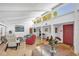 Spacious light filled living room with high ceilings and access to the front door at 448 58Th St, Sarasota, FL 34243