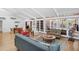 Bright living room featuring vaulted ceilings, hardwood floors, and an abundance of natural light at 448 58Th St, Sarasota, FL 34243