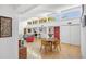 Open-concept living room and dining area with large windows and bright natural light at 448 58Th St, Sarasota, FL 34243