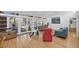 Bright and open living room with multiple glass sliders, wood floors and vaulted ceilings at 448 58Th St, Sarasota, FL 34243