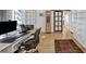 This office space features built in shelves, a modern desk, hardwood floors, and decor at 448 58Th St, Sarasota, FL 34243