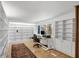 This office has built-in bookshelves, a desk with a view, and hardwood floors at 448 58Th St, Sarasota, FL 34243