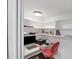 Compact home office with built-in shelving, desk area, and comfortable chair at 448 58Th St, Sarasota, FL 34243