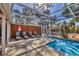 A beautiful outdoor pool and deck area perfect for relaxing and entertaining at 448 58Th St, Sarasota, FL 34243
