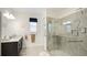 Modern bathroom featuring a glass-enclosed shower, vanity, and updated fixtures at 5416 Hope Sound Cir, Sarasota, FL 34238