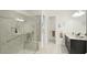 Bathroom featuring a spacious glass shower with a seat, double sink vanity, and modern fixtures at 5416 Hope Sound Cir, Sarasota, FL 34238