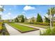 Well-maintained bocce ball court surrounded by lush landscaping, perfect for outdoor recreation at 5416 Hope Sound Cir, Sarasota, FL 34238