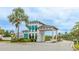 The gated community entrance offers security and a welcoming aesthetic with lush landscaping and classic architectural features at 5416 Hope Sound Cir, Sarasota, FL 34238