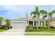 Charming single-story home featuring a two-car garage, well-manicured landscaping, and inviting front porch at 5416 Hope Sound Cir, Sarasota, FL 34238