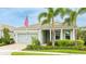 Inviting single-story home with manicured landscaping, a two-car garage, and a welcoming front porch at 5416 Hope Sound Cir, Sarasota, FL 34238
