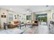 Spacious living room featuring a slider to a screened lanai for seamless indoor/outdoor living at 5416 Hope Sound Cir, Sarasota, FL 34238