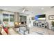 Inviting living room with a large TV and access to the outdoor patio at 5416 Hope Sound Cir, Sarasota, FL 34238