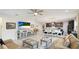 An open living space with a kitchen, dining and Gathering room with neutral tones at 5416 Hope Sound Cir, Sarasota, FL 34238