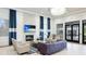 Comfortable lounge area with a fireplace, TV, and stylish furniture, perfect for relaxation at 5416 Hope Sound Cir, Sarasota, FL 34238
