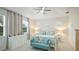 Bright bedroom with neutral tones, tray ceiling, ceiling fan, and comfortable furnishings at 5416 Hope Sound Cir, Sarasota, FL 34238