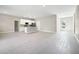 Open concept space includes kitchen, dining, and Gathering room areas, and neutral decor at 5454 Rhapsody Ave, North Port, FL 34288