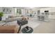 Bright living room flows into the kitchen with plenty of natural light, modern furnishings, and decor at 5454 Rhapsody Ave, North Port, FL 34288