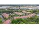 Aerial view of condo community near lake, showcasing manicured landscaping and community amenities at 5691 Bentgrass Dr # 211, Sarasota, FL 34235