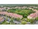 Sprawling multi-unit complex with meticulously maintained landscaping, ample parking and attractive architectural design at 5691 Bentgrass Dr # 211, Sarasota, FL 34235