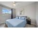 Bedroom features a large window, ceiling fan, and neutral paint at 5691 Bentgrass Dr # 211, Sarasota, FL 34235