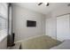 Bedroom with neutral walls, a ceiling fan, and closet for storage at 5691 Bentgrass Dr # 211, Sarasota, FL 34235