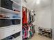 Walk-in closet features shelving, drawers and hanging storage space at 5691 Bentgrass Dr # 211, Sarasota, FL 34235
