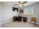 Home office includes a modern desk, chair, and natural light at 5691 Bentgrass Dr # 211, Sarasota, FL 34235