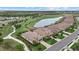 Beautiful aerial view of single-Gathering homes along a manicured golf course and lake in a residential community at 5811 Brandon Run, Bradenton, FL 34211