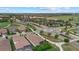 Aerial view of community, showcasing lush landscaping, streets and houses at 5811 Brandon Run, Bradenton, FL 34211