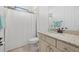 Bathroom with granite vanity top and cabinetry, toilet, and shower with curtain at 5811 Brandon Run, Bradenton, FL 34211