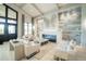Bright living room with fireplace, tile accent wall, and comfortable seating, ideal for relaxation and entertainment at 5811 Brandon Run, Bradenton, FL 34211
