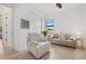 Bright living room with comfortable seating, large window and tile flooring at 5811 Brandon Run, Bradenton, FL 34211