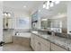 Luxurious bathroom with double vanity, soaking tub, and elegant finishes at 5917 Cessna Run, Lakewood Ranch, FL 34211