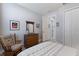 Comfortable bedroom featuring a wood dresser and soothing decor at 5917 Cessna Run, Lakewood Ranch, FL 34211