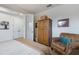Bedroom featuring a wood wardrobe and neutral decor at 5917 Cessna Run, Lakewood Ranch, FL 34211