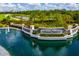 Community entrance with decorative water feature, mature landscaping, and a stone Lakewood National sign at 5917 Cessna Run, Lakewood Ranch, FL 34211