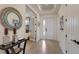 Spacious foyer with tile flooring, tray ceiling, and elegant decor leading to other rooms at 5917 Cessna Run, Lakewood Ranch, FL 34211