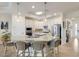 Bright kitchen featuring white cabinets, granite countertops, a large island, and modern appliances at 5917 Cessna Run, Lakewood Ranch, FL 34211