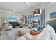 Spacious living room features an open floor plan and access to a screened-in patio with a pool at 5917 Cessna Run, Lakewood Ranch, FL 34211