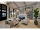 Comfortable lounge area featuring a cozy fireplace and neutral decor at 5917 Cessna Run, Lakewood Ranch, FL 34211