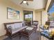 The outdoor living area features comfortable seating and views of the backyard at 5917 Cessna Run, Lakewood Ranch, FL 34211