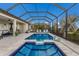 A luxurious screened-in pool and spa area offers a relaxing outdoor living space at 5917 Cessna Run, Lakewood Ranch, FL 34211