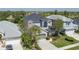 Aerial view of a charming two-story home with a well-maintained lawn and an attached two-car garage at 6210 Laurel Creek Trl, Ellenton, FL 34222