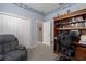 Study with built-in desk and chair, a window, and double wardrobe closet at 6210 Laurel Creek Trl, Ellenton, FL 34222
