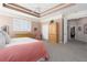 Spacious carpeted bedroom featuring shuttered windows and stylish furniture at 6210 Laurel Creek Trl, Ellenton, FL 34222