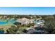 Aerial view of the community clubhouse with tennis courts and pool at 6210 Laurel Creek Trl, Ellenton, FL 34222