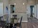 Stylish community dining area with modern decor, featuring a unique stone wall and sleek furnishings at 6210 Laurel Creek Trl, Ellenton, FL 34222